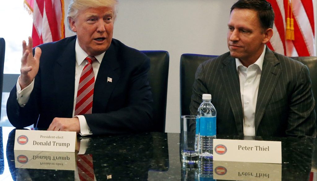 FILE PHOTO: U.S. President-elect Donald Trump sits with PayPal co-founder and Facebook board member Peter Thiel, during a meeting with technology leaders at Trump Tower in New York