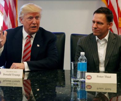 FILE PHOTO: U.S. President-elect Donald Trump sits with PayPal co-founder and Facebook board member Peter Thiel, during a meeting with technology leaders at Trump Tower in New York